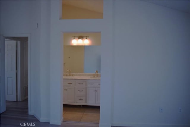 13548 Mount Ranier Way, Hesperia, CA 92345 - bathroom with vaulted ceiling and double vanity