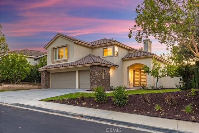 2943 Westbourne Pl, Rowland Heights, CA 91748 - mediterranean / spanish-style home featuring a chimney, driveway, a tile roof, an attached garage, and stucco siding