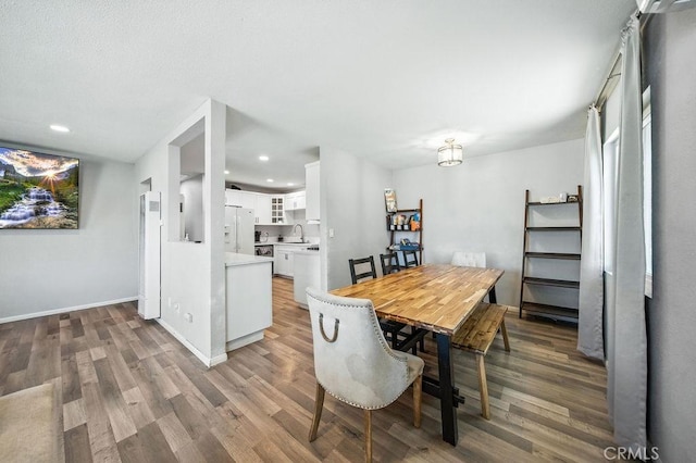 149 S Mistletoe Ave, San Jacinto, CA 92583 - dining area featuring wood finished floors and recessed lighting