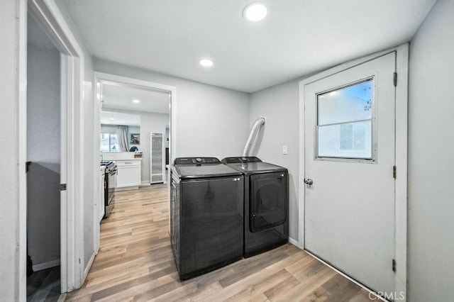 149 S Mistletoe Ave, San Jacinto, CA 92583 - laundry area with washing machine and clothes dryer, light wood-style floors, and recessed lighting
