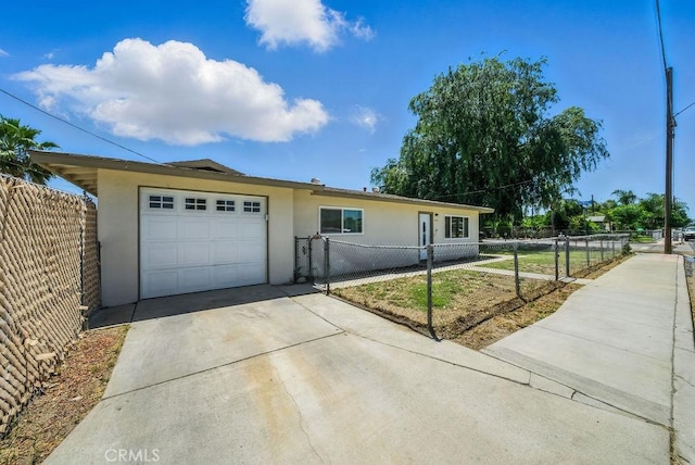 149 S Mistletoe Ave, San Jacinto, CA 92583 - single story home featuring stucco siding, concrete driveway, an attached garage, and a fenced front yard