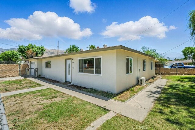 149 S Mistletoe Ave, San Jacinto, CA 92583 - view of front of home with stucco siding and a gate