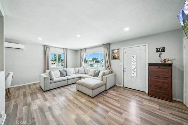 149 S Mistletoe Ave, San Jacinto, CA 92583 - living area with light wood-style flooring, recessed lighting, and a wall mounted AC