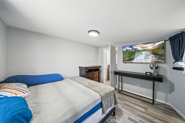 149 S Mistletoe Ave, San Jacinto, CA 92583 - bedroom featuring wood finished floors and baseboards