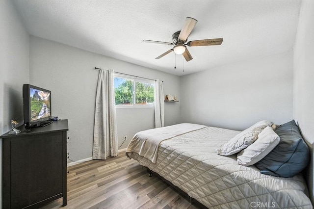 149 S Mistletoe Ave, San Jacinto, CA 92583 - bedroom featuring wood finished floors and ceiling fan