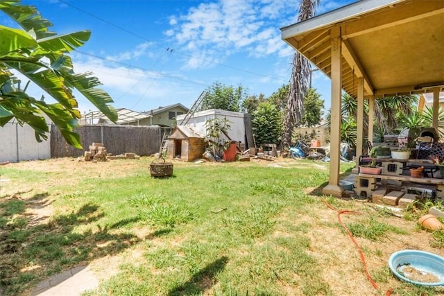 9130 Hargill, Bellflower, CA 90706 - view of yard featuring a storage shed and an outdoor fire pit