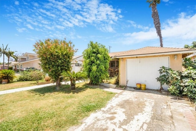 9130 Hargill, Bellflower, CA 90706 - view of front of home with a front yard, stucco siding, and an attached garage
