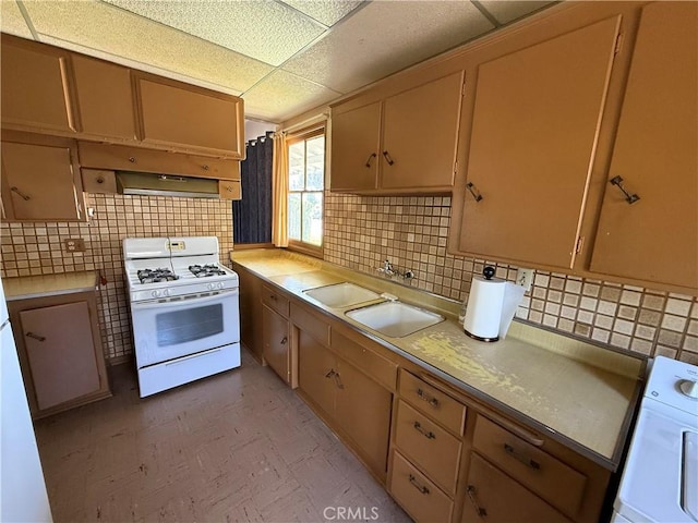 1836 E Walnut Crk, West Covina, CA 91791 - kitchen featuring white gas stove, backsplash, light countertops, a drop ceiling, and under cabinet range hood