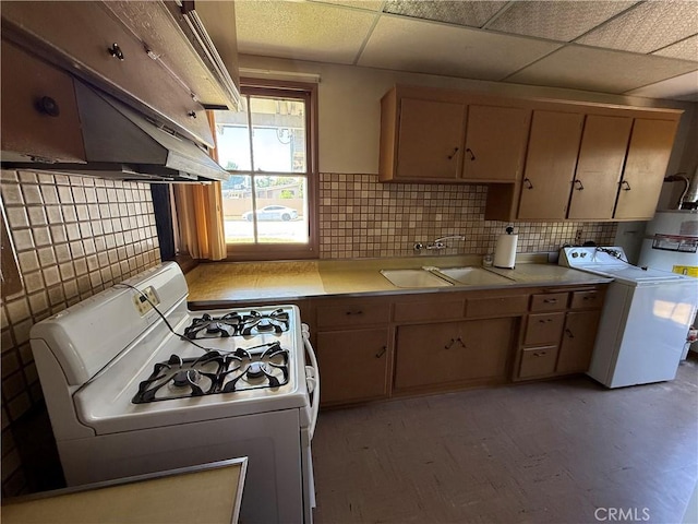 1836 E Walnut Crk, West Covina, CA 91791 - kitchen featuring white range with gas stovetop, washer / clothes dryer, custom exhaust hood, light countertops, and backsplash