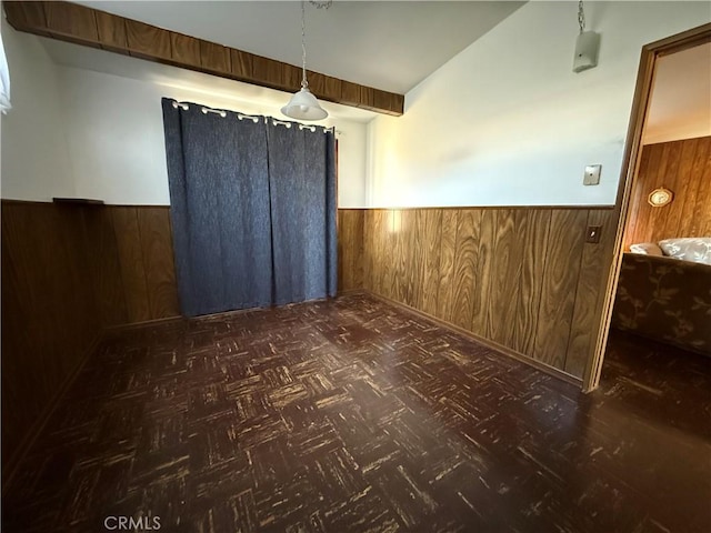 1836 E Walnut Crk, West Covina, CA 91791 - unfurnished dining area featuring a wainscoted wall, wood walls, and vaulted ceiling