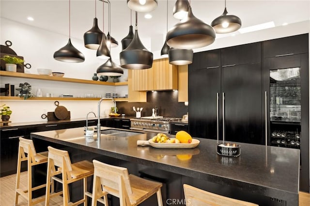 2301 Santiago Dr, Newport Beach, CA 92660 - kitchen with stainless steel stove, dark cabinets, open shelves, dark countertops, and modern cabinets