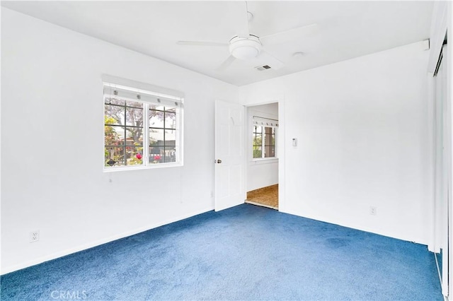 1613 W 56th St, Los Angeles, CA 90062 - carpeted empty room with ceiling fan