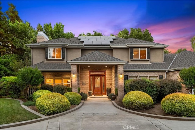 3130 Shady Grove Ct, Chico, CA 95973 - prairie-style house featuring stucco siding, brick siding, and solar panels