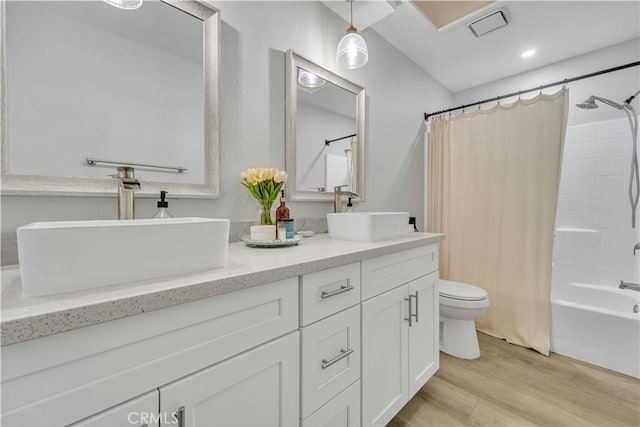 6231 Almond Valley Way, Quartz Hill, CA 93536 - bathroom featuring double vanity, wood finished floors, and shower / tub combo with curtain