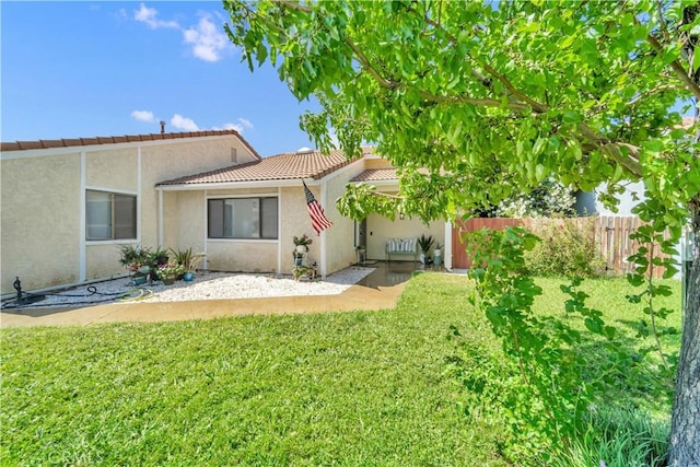 6231 Almond Valley Way, Quartz Hill, CA 93536 - rear view of house with a tile roof and stucco siding