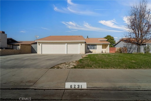 6231 Almond Valley Way, Quartz Hill, CA 93536 - ranch-style home with concrete driveway, a tile roof, a garage, and stucco siding