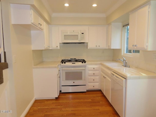 808 Magnolia Ave Unit 3, Pasadena, CA 91106 - kitchen with white appliances, tile countertops, crown molding, white cabinetry, and recessed lighting