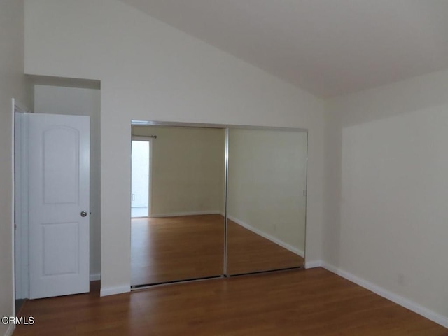 808 Magnolia Ave Unit 3, Pasadena, CA 91106 - unfurnished bedroom with wood finished floors, vaulted ceiling, and a closet