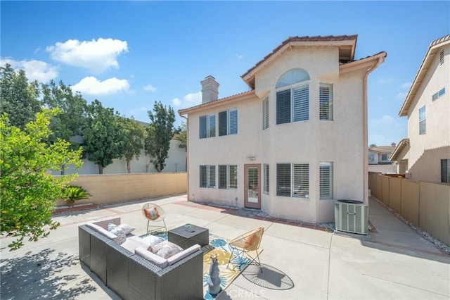 575 E Nubia St, Covina, CA 91722 - back of house with stucco siding, a chimney, a patio area, a fenced backyard, and an outdoor living space