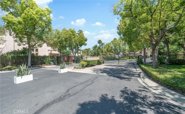 575 E Nubia St, Covina, CA 91722 - view of asphalt street with a gate, curbs, and a gated entry
