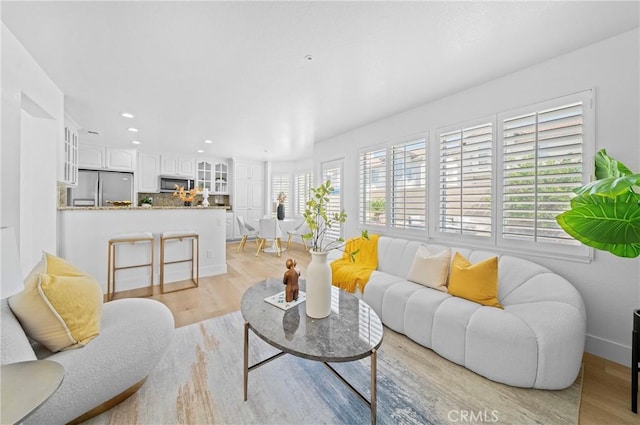575 E Nubia St, Covina, CA 91722 - living room featuring light wood finished floors and recessed lighting