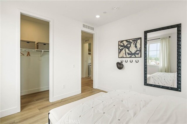 4836 Arroyo Run, Moorpark, CA 93021 - bedroom featuring light wood-style flooring, recessed lighting, and a spacious closet