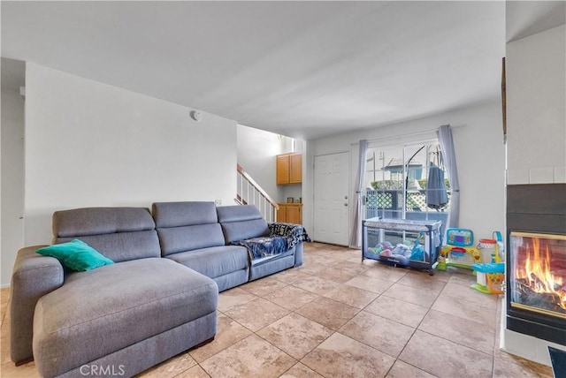 8270 Sutterhome Pl, Rancho Cucamonga, CA 91730 - living area with a multi sided fireplace, stairway, and light tile patterned flooring