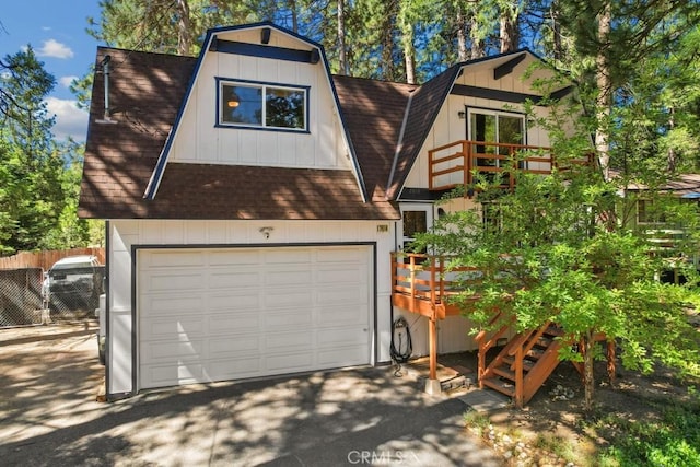 2616 Secret Dr, Running Springs, CA 92382 - view of front facade with a shingled roof, a gambrel roof, and a garage