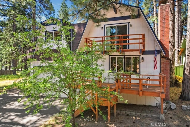 2616 Secret Dr, Running Springs, CA 92382 - rear view of property featuring a balcony, a wooden deck, and a shingled roof