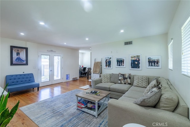 10838 Burnet Ave, San Fernando, CA 91345 - living area with plenty of natural light, wood finished floors, french doors, and recessed lighting