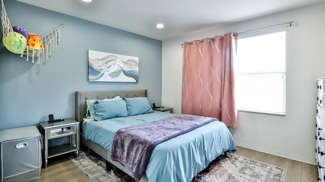 17554 Waterfall Ct, Fountain Valley, CA 92708 - bedroom with multiple windows, wood finished floors, and recessed lighting