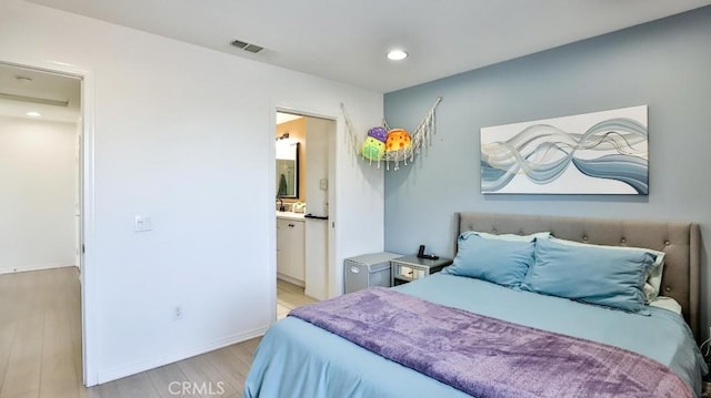 17554 Waterfall Ct, Fountain Valley, CA 92708 - bedroom with light wood-type flooring, recessed lighting, and ensuite bathroom