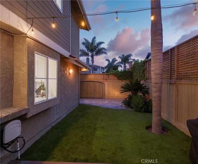 2017 Curtis Ave Unit B, Redondo Beach, CA 90278 - yard at dusk with a fenced backyard and a patio