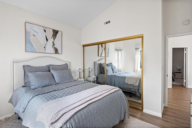 2017 Curtis Ave Unit B, Redondo Beach, CA 90278 - bedroom with wood finished floors, a closet, and high vaulted ceiling