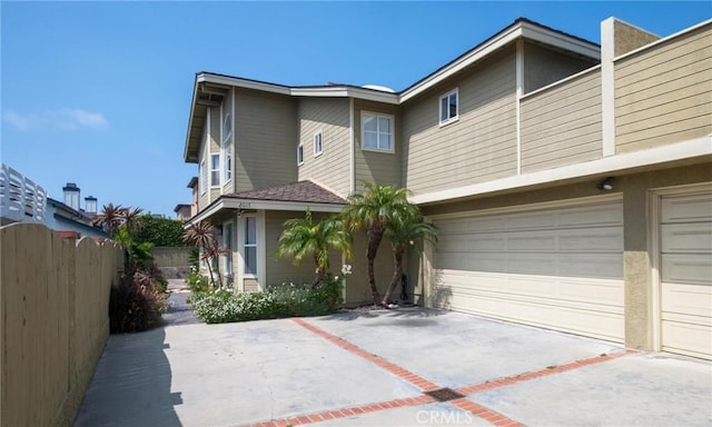 2017 Curtis Ave Unit B, Redondo Beach, CA 90278 - rear view of property with driveway and an attached garage