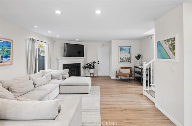 2017 Curtis Ave Unit B, Redondo Beach, CA 90278 - living area featuring light wood-type flooring, recessed lighting, and a glass covered fireplace