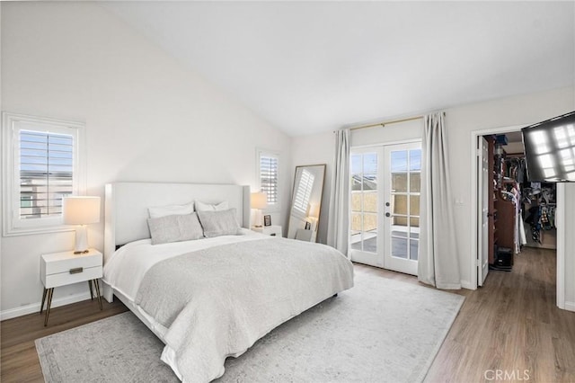 2017 Curtis Ave Unit B, Redondo Beach, CA 90278 - bedroom with access to exterior, wood finished floors, lofted ceiling, french doors, and a spacious closet
