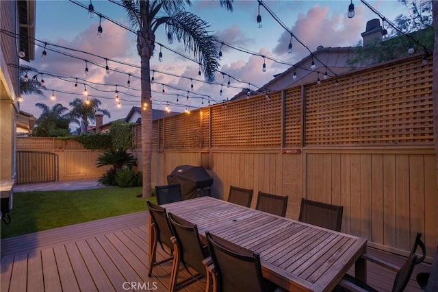 2017 Curtis Ave Unit B, Redondo Beach, CA 90278 - deck at dusk featuring a fenced backyard, area for grilling, and outdoor dining space