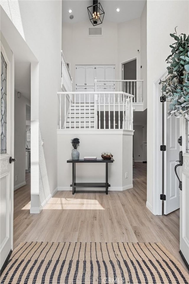 2017 Curtis Ave Unit B, Redondo Beach, CA 90278 - foyer entrance with a towering ceiling, stairway, light wood-style flooring, and recessed lighting