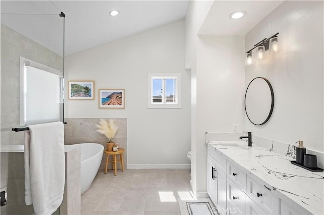 2017 Curtis Ave Unit B, Redondo Beach, CA 90278 - full bath with double vanity, a soaking tub, vaulted ceiling, recessed lighting, and tile patterned floors