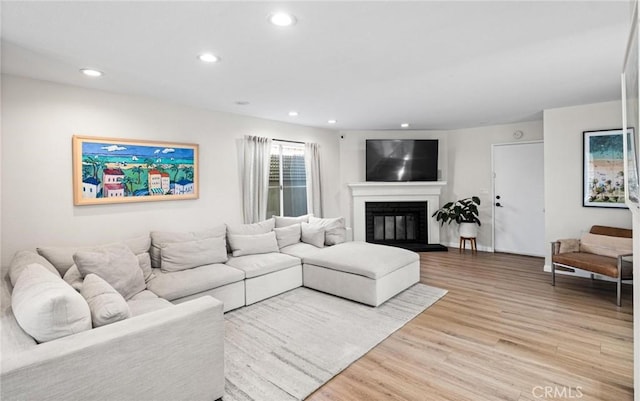2017 Curtis Ave Unit B, Redondo Beach, CA 90278 - living area with light wood-style flooring, recessed lighting, and a glass covered fireplace
