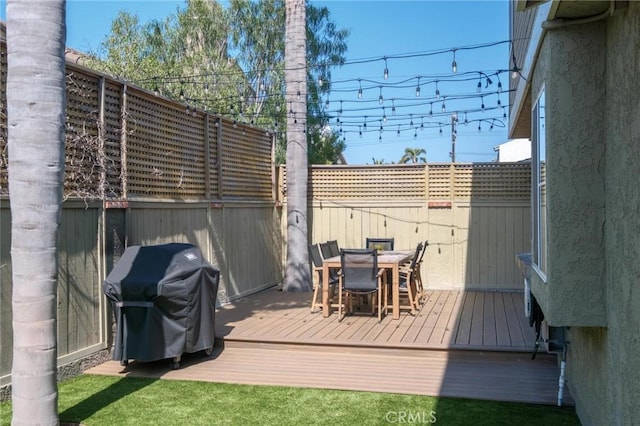 2017 Curtis Ave Unit B, Redondo Beach, CA 90278 - wooden deck featuring area for grilling, outdoor dining area, and a fenced backyard