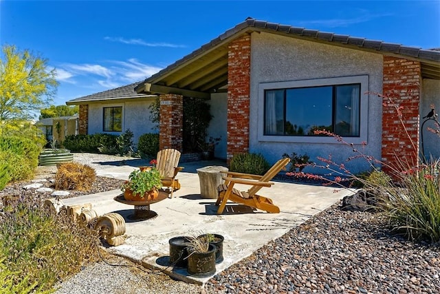 15381 Otomian Rd, Apple Valley, CA 92307 - view of front of home featuring a patio area and stucco siding