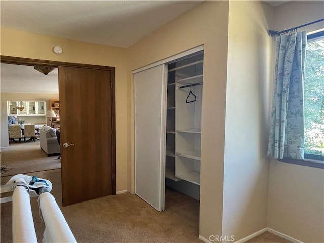 15381 Otomian Rd, Apple Valley, CA 92307 - corridor featuring carpet flooring and baseboards