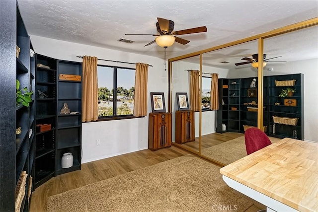 15381 Otomian Rd, Apple Valley, CA 92307 - office with ceiling fan and wood finished floors