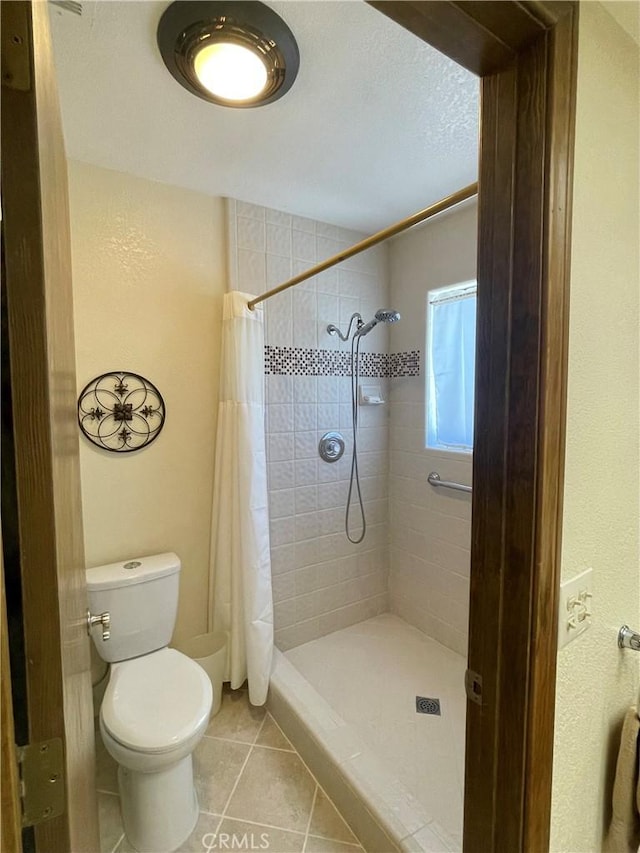 15381 Otomian Rd, Apple Valley, CA 92307 - bathroom with tile patterned floors and a stall shower