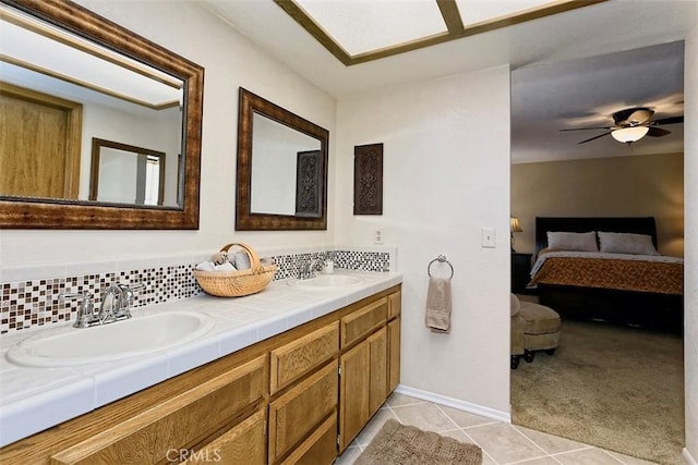 15381 Otomian Rd, Apple Valley, CA 92307 - full bathroom featuring connected bathroom, double vanity, tile patterned floors, and a ceiling fan