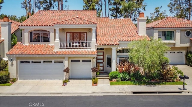 3167 Corte Portofino, Newport Beach, CA 92660 - mediterranean / spanish-style home featuring a balcony, a garage, driveway, and stucco siding