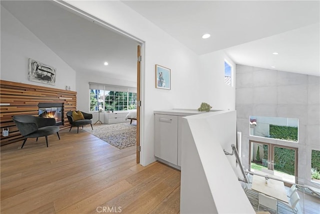 3167 Corte Portofino, Newport Beach, CA 92660 - hallway featuring light wood finished floors, recessed lighting, an upstairs landing, and vaulted ceiling