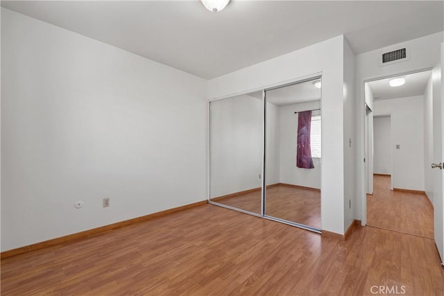 7137 Shoup Ave Unit 39, West Hills, CA 91307 - unfurnished bedroom with light wood-style flooring and a closet